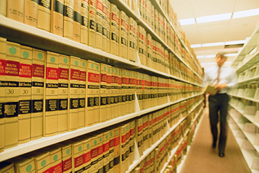 Photograph: A man walks past a shelf full of the South Western Reporter