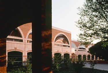 Photograph: The law library viewed through a shadowy arch of the Raba Building.